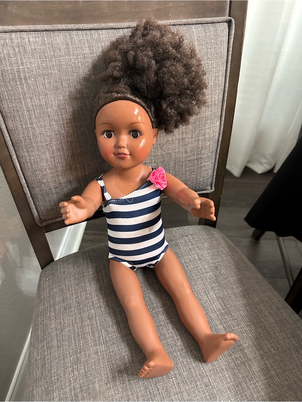 Brown Skin Striped Navy & White Swimsuit Doll with Pink Flower Accent